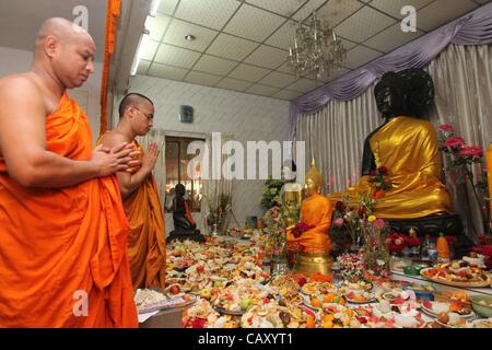 May 6, 2012 - Dhaka, Bangladesh - 06 May 2012. Dhaka,Bangladesh- The Buddhist community celebrates Budda Purnima by performing special worship & light candle paper  at the Old part of Dhaka Bashabo Buddhist Temple. The day marks Gautam Buddha's birth, enlightenment and death. It falls on the day of  Stock Photo