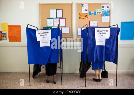 Kolonaki, Athens, Hellas. 06.05.2012 Image shows Greek people voting inside voting booths at a Polling Station on election day in the wealthy neighbourhood of Kolonaki, Athens, Greece. Stock Photo