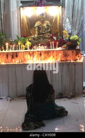 May 6, 2012 - Dhaka, Bangladesh - The Buddhist community celebrates Buddha Purnima by performing special worship and light paper candles at the Old part of Dhaka Bashabo Buddhist Temple. The day marks Gautam Buddha's birth, enlightenment and death. It falls on the day of the full moon in May. The Bu Stock Photo