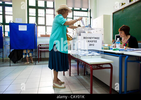 Greek Election. Kolonaki, Athens, Hellas. 06.05.2012 Image shows a Greek lady voting inside the Polling Station on election day in the wealthy neighbourhood of Kolonaki, Athens, Greece. Stock Photo