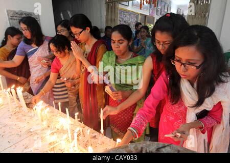 May 6, 2012 - Dhaka, Bangladesh - The Buddhist community celebrates Buddha Purnima by performing special worship and light paper candles at the Old part of Dhaka Bashabo Buddhist Temple. The day marks Gautam Buddha's birth, enlightenment and death. It falls on the day of the full moon in May. The Bu Stock Photo