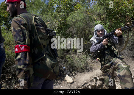 May 6, 2012 - Free Syrian Army member fighting with regular Syrian army in the hills of Idlib province, northern Syria...The Free Syrian Army continues to oppose the Assad regime throughout Syria despite the Syrian army targeting many of the villages and towns thought to be supportive of the Free Sy Stock Photo