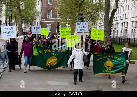 London, United Kingdom, 06/May/2012. Migrant workers march to the Houses of Parliament where they staged a rally to demand wages that is fair. The march was organised by United Workers Association (UWA) as a response of news last week that some domestic workers were allegedly being paid below minimu Stock Photo