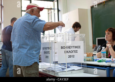 Greek Elections. Kolonaki, Athens, Greece. 06.05.2012 Image shows Greek people voting inside a Polling Station on election day in the wealthy neighbourhood of Kolonaki, Athens, Greece. Stock Photo