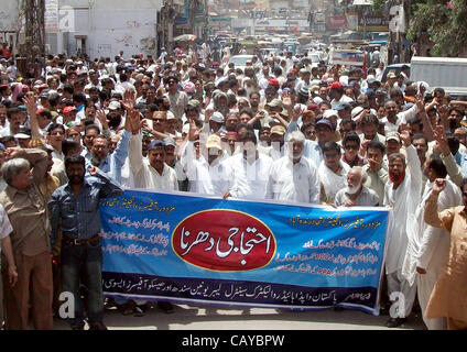 Members of WAPDA Hydro Electric Central Labor Union are protesting in favor of their demands during rally in Hyderabad on Tuesday, May 08, 2012. Stock Photo
