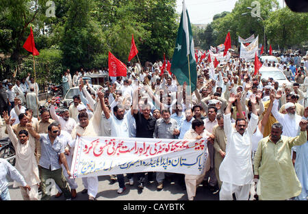 Members of WAPDA Hydro Electric Central Labor Union are protesting in favor of their demands during rally in Lahore on Tuesday, April 24, 2012. Stock Photo