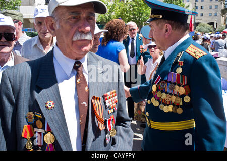 WWII veterans from around the country assemble in Jerusalem for a colorful march, many in their WWII uniforms with medals, decorations and grandchildren, celebrating Allied victory over Nazi Germany. Jerusalem, Israel. 9-May-2012. Stock Photo