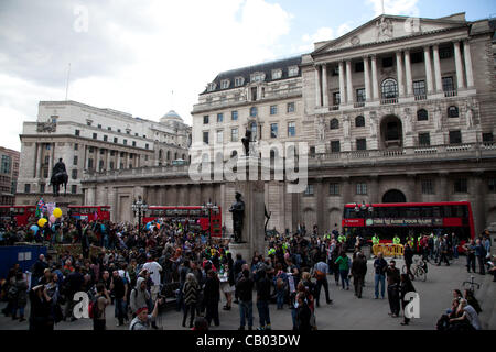 London, UK. 12 May 2012 Protesters marched through the financial district holding up banners against corruption and greed of the 1% before stopping outside the Bank of England. Stock Photo