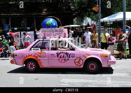 Annual Art Car Parade held in downtown Houston, Texas, USA, on May 12, 2012. Pink car calls for peace. Stock Photo