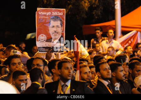 May 12, 2012 - Cairo, Egypt - Thousands of Egyptians attended a campaign rally for the Muslim Brotherhood's presidential candidate, Mohamed Morsy, at Cairo University on Saturday. The show of support was meant to counter the perception that Morsy was the Brotherhood's second choice after their first Stock Photo