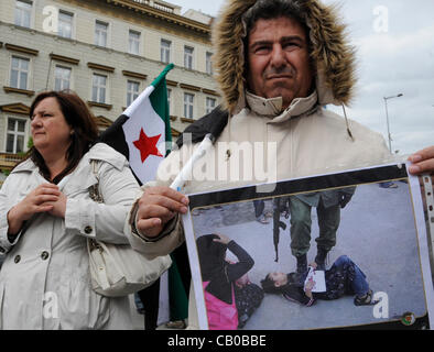 Anti-Syrian regime protesters call for Syrian President Bashar Assad to step down at Wenceslas Square in Prague, Czech Republic, Sunday, April 13, 2012. (CTK Photo/Michal Krumphanzl) Stock Photo
