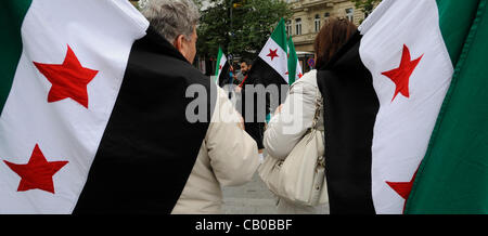 Anti-Syrian regime protesters call for Syrian President Bashar Assad to step down at Wenceslas Square in Prague, Czech Republic, Sunday, April 13, 2012. (CTK Photo/Michal Krumphanzl) Stock Photo