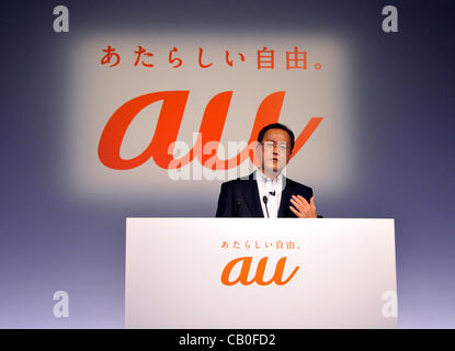 May 15, 2012, Tokyo, Japan - President Koji Tanaka of Japans KDDI introduces a new lineup of mobile phone summer models and video and music distribution services for mobile phones during a launch in Tokyo on Tuesday, May 15, 2012. The countrys second largest carrier unveiled five new types of smartp Stock Photo