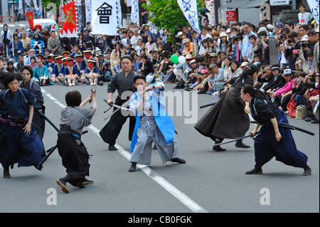 Tokyo, Japan - March 13: People in costumes of Shinsengumi, a group of Samurais of late 1800's, showed the spectators some famous scenes of battles that the group had as a part of Hino Shinsengumi Festival at Hino, Tokyo, Japan, on May 13, 2012. Since some of the members were born in this town, and  Stock Photo