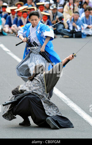 Tokyo, Japan - March 13: People in costumes of Shinsengumi, a group of Samurais of late 1800's, showed the spectators some famous scenes of battles that the group had as a part of Hino Shinsengumi Festival at Hino, Tokyo, Japan, on May 13, 2012. Since some of the members were born in this town, and  Stock Photo