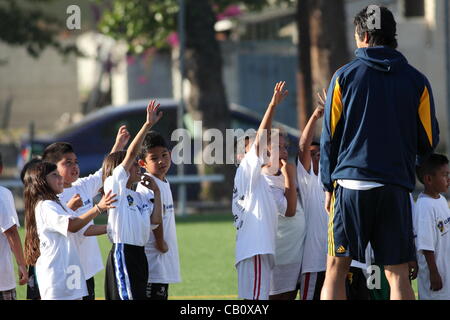 PASADENA, CALIFORNIA, - MAY 16, 2012 – The LA Galaxy soccer club participates in a soccer clinic for members of the Villa Parke soccer league in Pasadena on May 16, 2012.  Children enjoy learning skills and playing matches with coaches and players from the LA Galaxy soccer club. Stock Photo