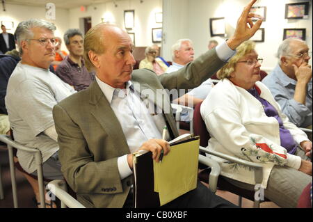 Speaking against Nassau County Executive’s Plan to Privatize Sewage Treatment Plants are County Legislator Dave Denenberg (Democrat) and civic leader Claudia Borecky on Wednesday, May 16, 2012, at Bellmore Library, New York, USA. Raising hand is Greg Naham, an Executive Board Member of NCCCA, the N Stock Photo