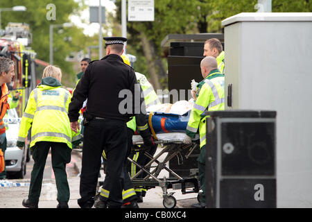Croydon UK. 16 May, 2012 . A 28-year-old woman was dragged 30m under a tram in Croydon, South London after trying to cross tram lines. Around 50 emergency services including fire, ambulance and police were on hand to extract the victim from under the tram. She was taken to hospital by air ambulance.