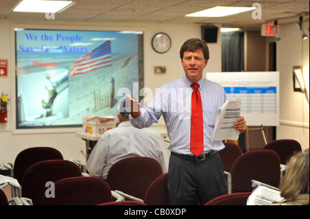 Speaking against Nassau County Executive’s Plan to Privatize Sewage Treatment Plants are County Legislator Dave Denenberg (shown standing), and civic leader Claudia Borecky on Wednesday, May 16, 2012, at Bellmore Library, New York, USA. Denenberg (Democrat - Merrick) represents District 19. Stock Photo