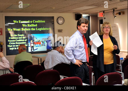 Speaking against Nassau County Executive’s Plan to Privatize Sewage Treatment Plants are County Legislator Dave Denenberg (Democrat) at left, and civic leader Claudia Borecky, at right, on Wednesday, May 16, 2012, at Bellmore Library, New York, USA. Borecky, a member of We the People Save our Waters Stock Photo