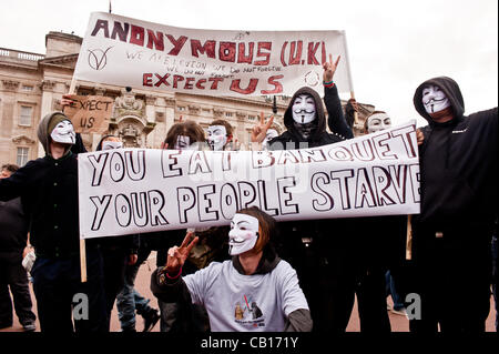 LONDON, UK - 18th May 2012: Occupy London and Anonymous protesters in front of Buckingham Palace denouncing the presence of the King of Bahrain and other country leaders in visit at Buckingham Palace for the Queen's Jubilee. Stock Photo