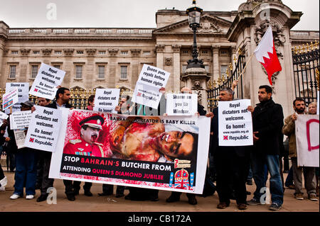 LONDON, UK - 18th May 2012: Protesters in front of Buckingham Palace denouncing the presence of the King of Bahrain and other country leaders in visit at Buckingham Palace for the Queen's Jubilee. Stock Photo