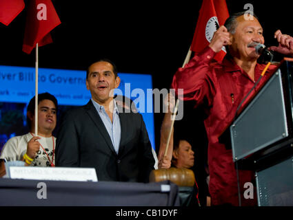 May 19, 2012 - Bakersfield, CA, USA -  UFW President Arturo Rodriguez tells the crowd to use their headphones for translation as Los Angeles Mayor Antonio Villaraigosa waits to address the delegates at the United Farm Workers' 50th Anniversary Convention. Some 2,000 delegates and supporters gathered Stock Photo