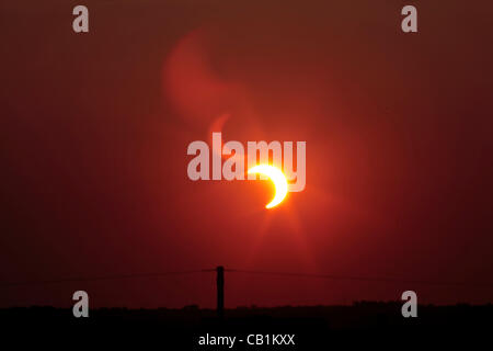 2012 annular solar eclipse, partial due to latitude, on 20 May, 2012. The eclipse occurred only a few minutes before sunset. Stock Photo