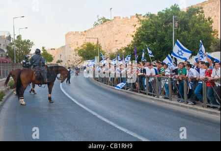 JERUSALEM - MAY 20 2012 : Israeli right wingers commemorating Jerusalem day with a march to Jerusalem old city on May 20 2012 , Jerusalem day marks the anniversary of Israel capturing the eastern part of the city during the 1967 Middle east war Stock Photo