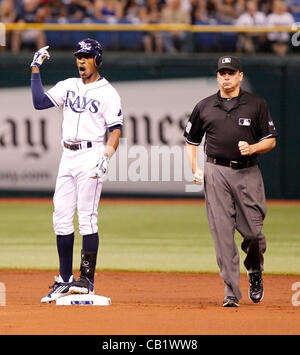 May 21, 2012 - St. Petersburg, FL, USA - JAMES BORCHUCK  |   Times.SP 353235 BORC rays (05/21/12) (St. Petersburg, FL) B.J. Upton points to the catwalks as second base umpire Andy Fletcher comes in for a conference with other umpires to determine if Upton's hit was a homerun during the Tampa Bay Ray Stock Photo