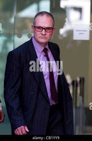 London, UK. 22nd May 2012. PC Alex MacFarlane leaves Westminster Magistrates Court, London. PC Alex MacFarlane allegedly racially abused a black man during last summer's riots. Stock Photo