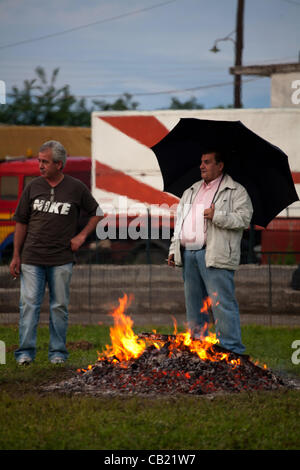 Anastenaria, is a traditional fire-walking ritual,in village called Agia Eleni, Serres,in Northern Greece,at the ceremony of Saint Kontsantinos ang Eleni,at 21-5-2012.Some people preparing the fire for the fire-walkers Stock Photo