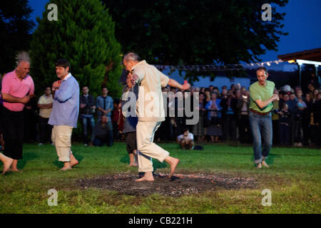 Anastenaria, is a traditional fire-walking ritual,in village called Agia Eleni, Serres,in Northern Greece,at the ceremony of Saint Kontsantinos ang Eleni,at 21-5-2012.The people (fire-walkers) making a dance with traditional byzantine music and songs,before walking without shos on fire.Many people c Stock Photo