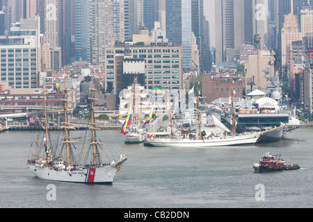 US Coast Guard Barque Eagle participates in the Parade of Sail on the Hudson River with other Tall Ships near the Intrepid Sea, Air, and Space Museum in New York City, USA on Wednesday, May 23, 2012.  The Parade of Sail kicked off Fleet Week New York City, an annual event celebrating sea services. Stock Photo