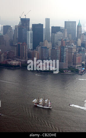 Aerial view of US Coast Guard tall sailing ship Eagle enters New York harbor during a parade of tall and military ships on the Hudson River to participate in Fleet Week May 23, 2012 in New York City, NY.  Fleet Week New York 2012 marks the 25th year the city has celebrated the nation's sea services. Stock Photo