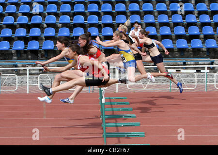 Yalta, Ukraine - May 24  girls age 17  at the hurdles race on the international athletic meet UKRAINE - TURKEY - BELARUS on May 24, 2012 in Yalta, Ukraine Stock Photo