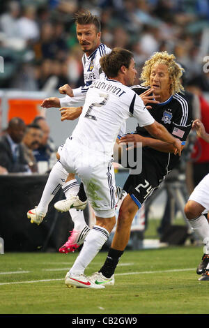 May 23, 2012 - Carson, California, United States of America - Todd Dunivant (2) of Los Angeles Galaxy, David Beckham (23) of Los Angeles Galaxy and Steven Lenhart (24) of San Jose Earthquakes collide mid air while on the attack in the first half during the Los Angeles Galaxy vs San Jose Earthquakes  Stock Photo