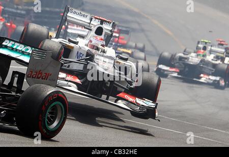 27.05.2012. Monaco Monte Carlo, F1 Grand Prix. Japanese Formula One driver Kamui Kobayashi (C) of Sauber has all 4 wheels airborne on his car during the start of the 2012 Monaco Formula One Grand Prix at the Monte Carlo circuit, in Monaco, 27 May 2012. Stock Photo