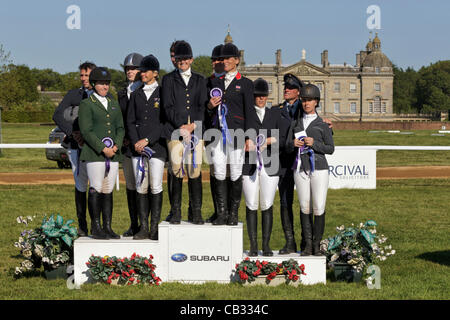 The podium presentation for the CCIO 3 star nations cup at the 2012 Subaru Houghton International Horse trials,in Norfolk, England. No1 team GBR, No2 team Australia, No3 team Germany Britain's No1 winning eventing team Francis Whittington & Piggy French(rear),Sarah Cohen &  Mary King(front) Stock Photo
