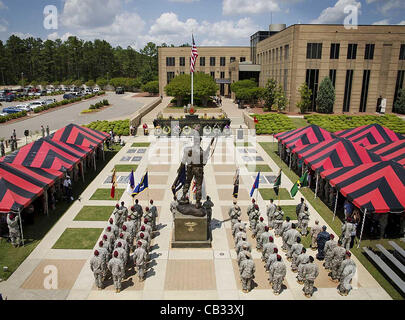 Special Forces soldiers from the US Army Special Operations Command stand in formation during the Fallen Soldier Memorial Ceremony in honor of Memorial Day May 26, 2012 at Memorial Plaza in Fort Bragg, North Carolina. Stock Photo