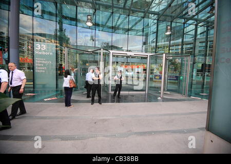 Monday 28th May 2012 Pay Up group target Sainsbury's head office as they call on the company to pay workers a living wage'. Credit Line : Credit:  HOT SHOTS / Alamy Live News Stock Photo