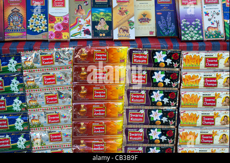 Boxes of Incense Sticks for sale on a market stall in India Stock Photo