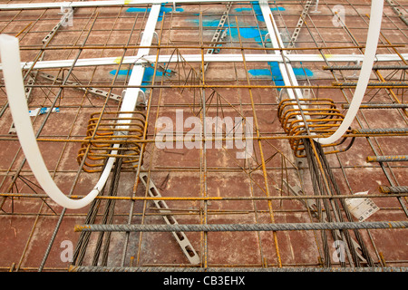 Post-tensioning steel cables in concrete floor formwork Stock Photo
