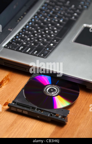 Laprop open CD player with a DVD inside Stock Photo