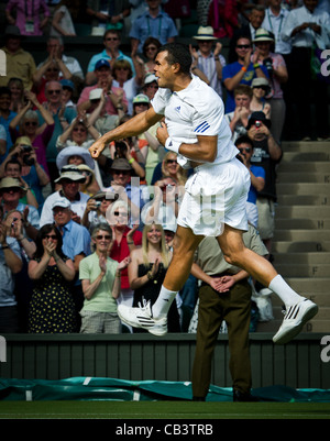 29.06.2011. Jo-Wilfried Tsonga FRA (12) v Roger Federer SUI (3). Tsonga celebrates his win. The Wimbledon Tennis Championships. Stock Photo