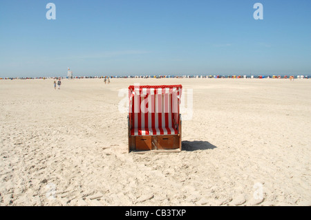 Wicker beach chair on the Kniepsand beach of Norddorf on the North Frisian island of Amrum in Northern Germany Stock Photo