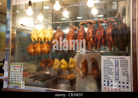 siu mei roast meats hanging in the window of a chinese restaurant hong kong island hksar china Stock Photo