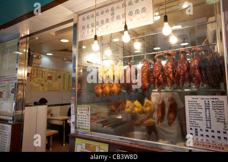 siu mei roast meats hanging in the window of a chinese restaurant hong kong island hksar china Stock Photo