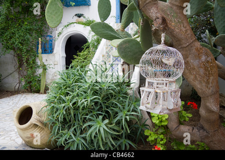 Courtyard with bird cage and cactus, Dar el Annabi house, Sidi bou Said near Tunis Tunisia Stock Photo