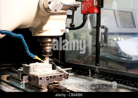 Engineering technician, Engineer working a CNC milling machine Stock Photo